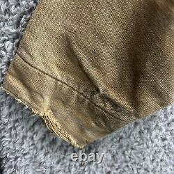Veste de travail en toile Carhartt taille M/L vintage couleur tan fortement usée doublée de couverture