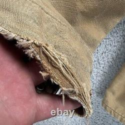 Veste de travail en toile Carhartt taille M/L vintage couleur tan fortement usée doublée de couverture